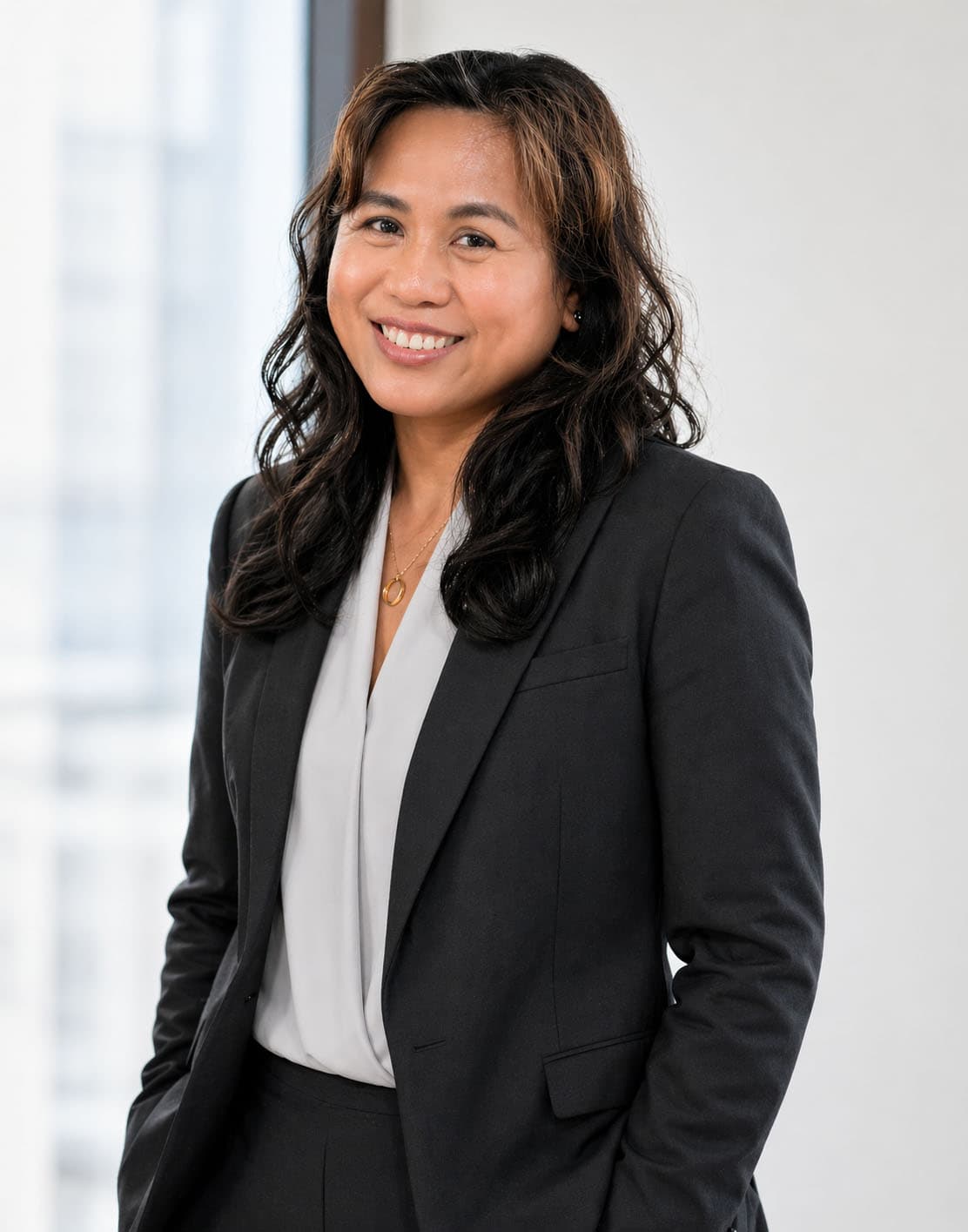 Professional portrait of Katherine Garcia, a healthcare marketing consultant, in professional attire against a neutral architectural background